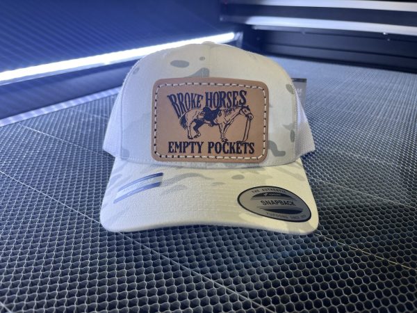 "Broke horses empty pockets" White camo snapback